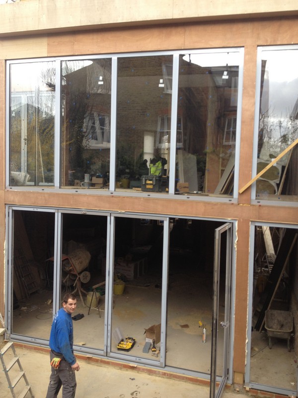 Aluminium bi-fold doors with two-storey glazing in Dulwich