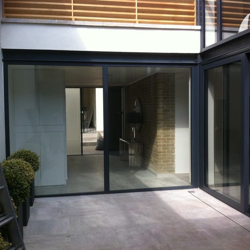 Floor-to-ceiling sliding doors opening to courtyard in Dulwich