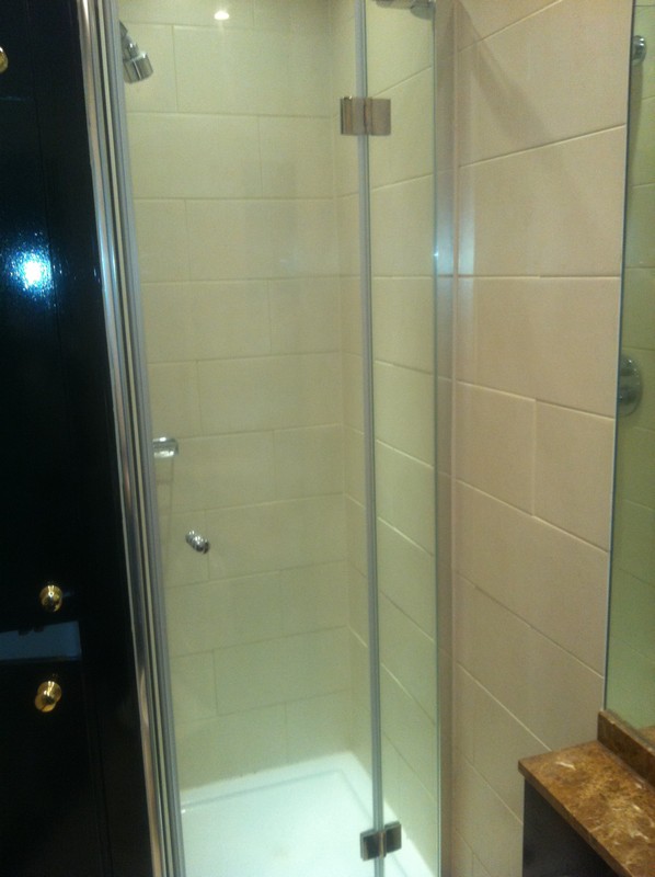 Frameless glass shower enclosure with chrome fittings in Dulwich