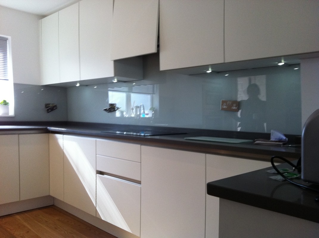 Grey glass kitchen splashback with LED lighting in Dulwich