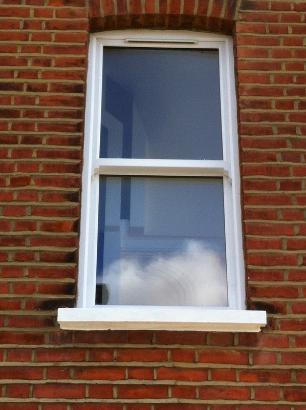 uPVC sash window on Victorian red brick house in Dulwich